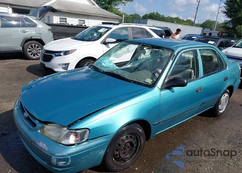 1999 Toyota Corolla Ce из США, поврежденный, VIN 2T1BR12E6XC134802